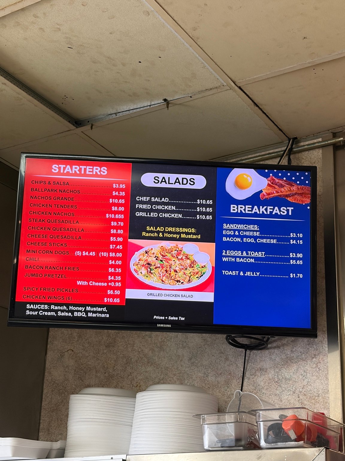 Ten Pin Lanes menu board showing starters, salads, and breakfast.
